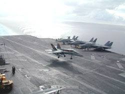 F/A-18 Hornet number 200, assigned to the Royal Maces of Strike/Fighter squadron (VFA) 27 catches the arresting wire aboard USS Kitty Hawk (CV 63) in the Gulf of Thailand. Lt. Cmdr. Chris Rollins, VFA 27's maintenance officer, from Whitwell, Tenn., made his 500th Kitty Hawk trap at 11:06 a.m. Wednesday, while flying this aircraft. He has accumulated approximately 600 traps throughout his naval career. (U.S. Navy photo by JO1(SW/AW) Mark A. Savage)